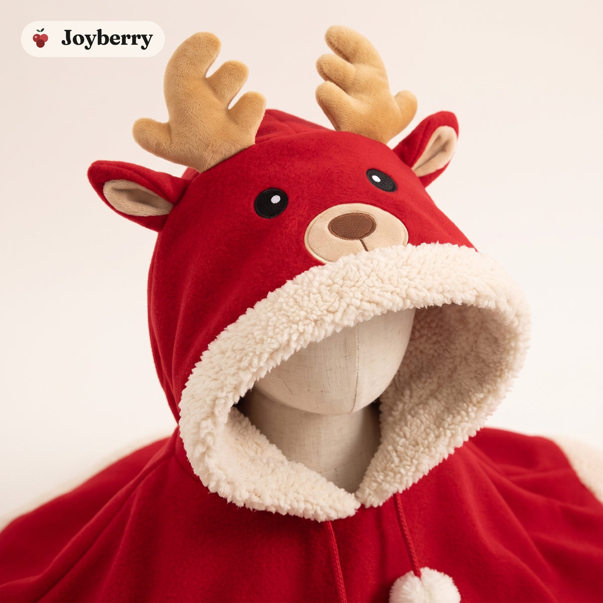 Close-up of the reindeer hood with plush antlers and embroidered face